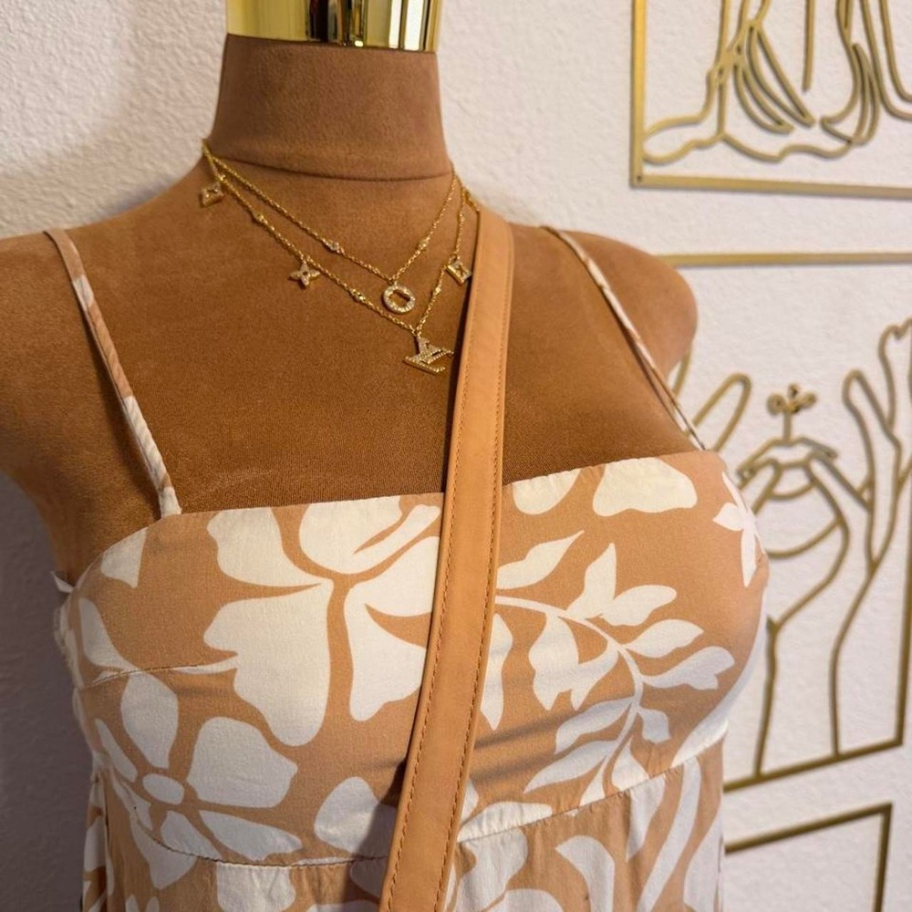 Tan and white floral maxi dress with spaghetti straps and flowy skirt - Picture 2 of 3